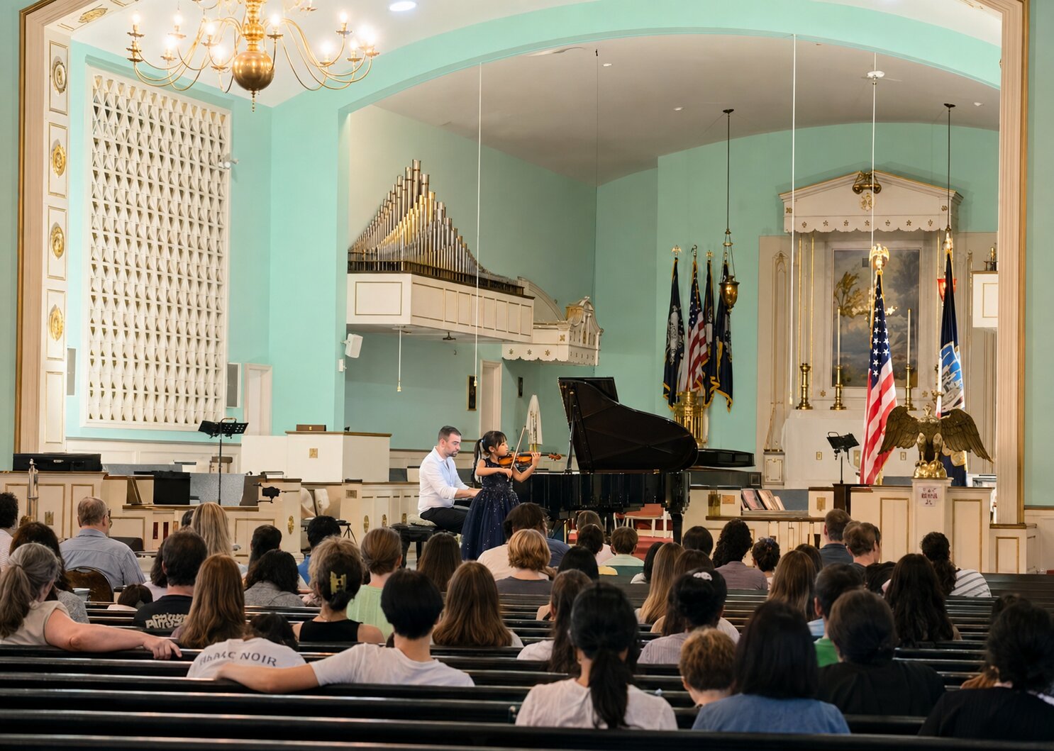 Hailey Murata performing on stage for a full audience