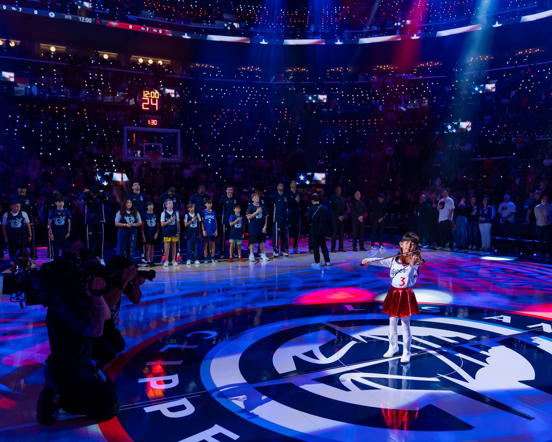 Hailey Murata performing the national anthem on the court before an LA Clippers game